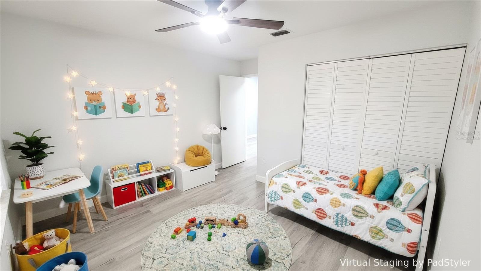Virtually staged 2nd bedroom/kid's room.