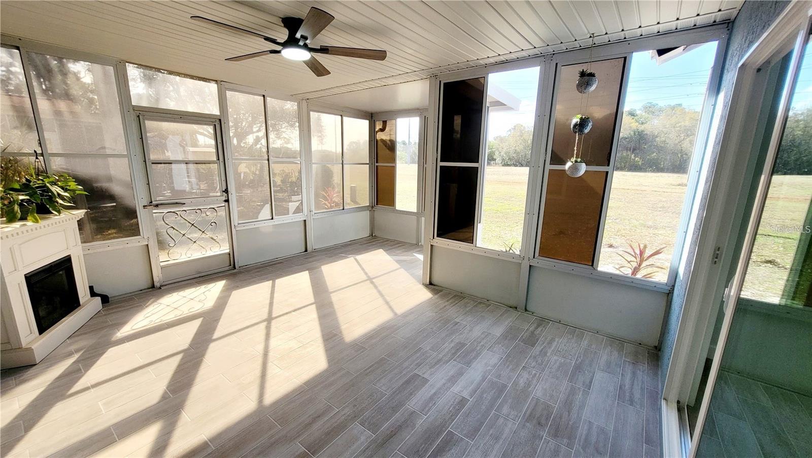 Enclosed Florida room with fireplace