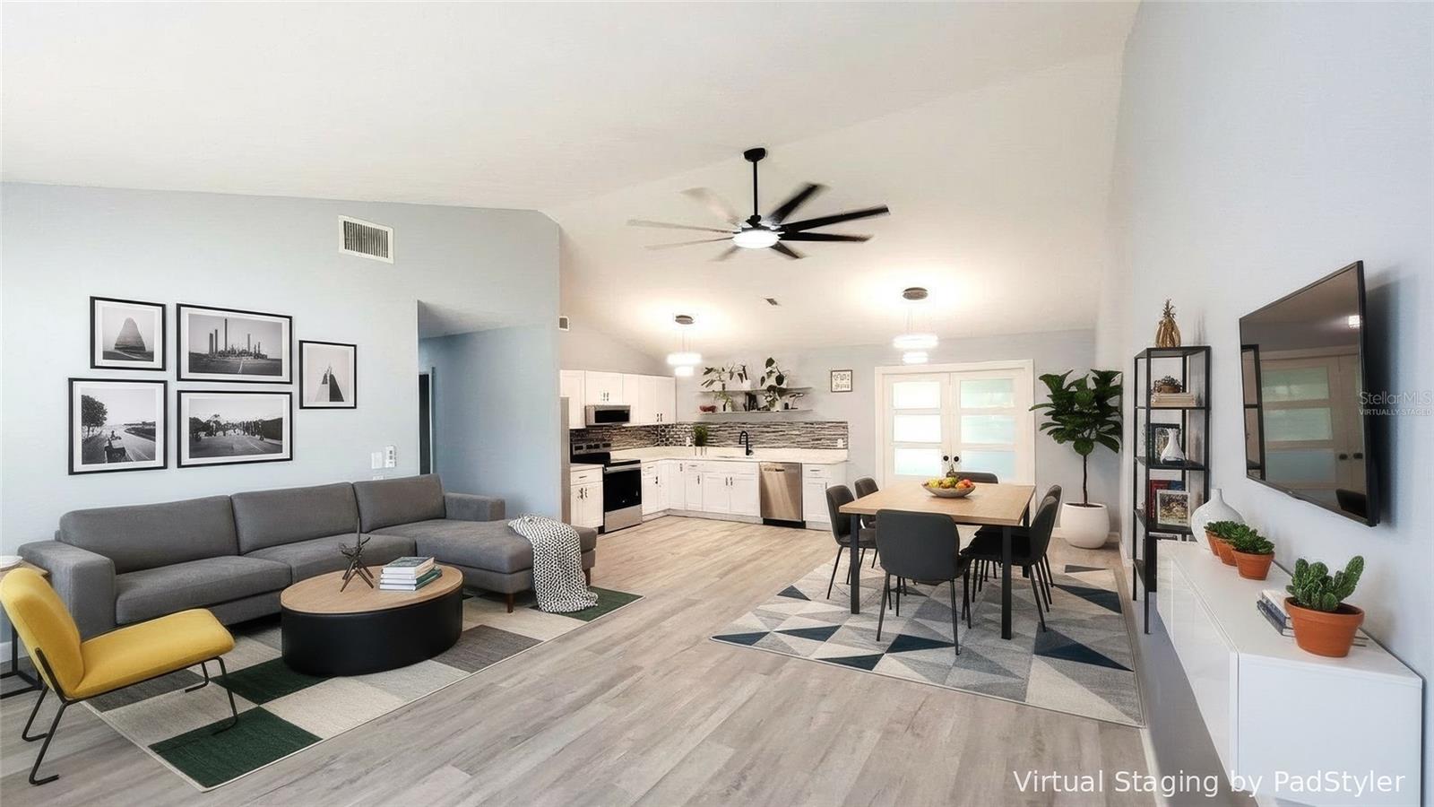 Virtually staged living room, dining room, kitchen.