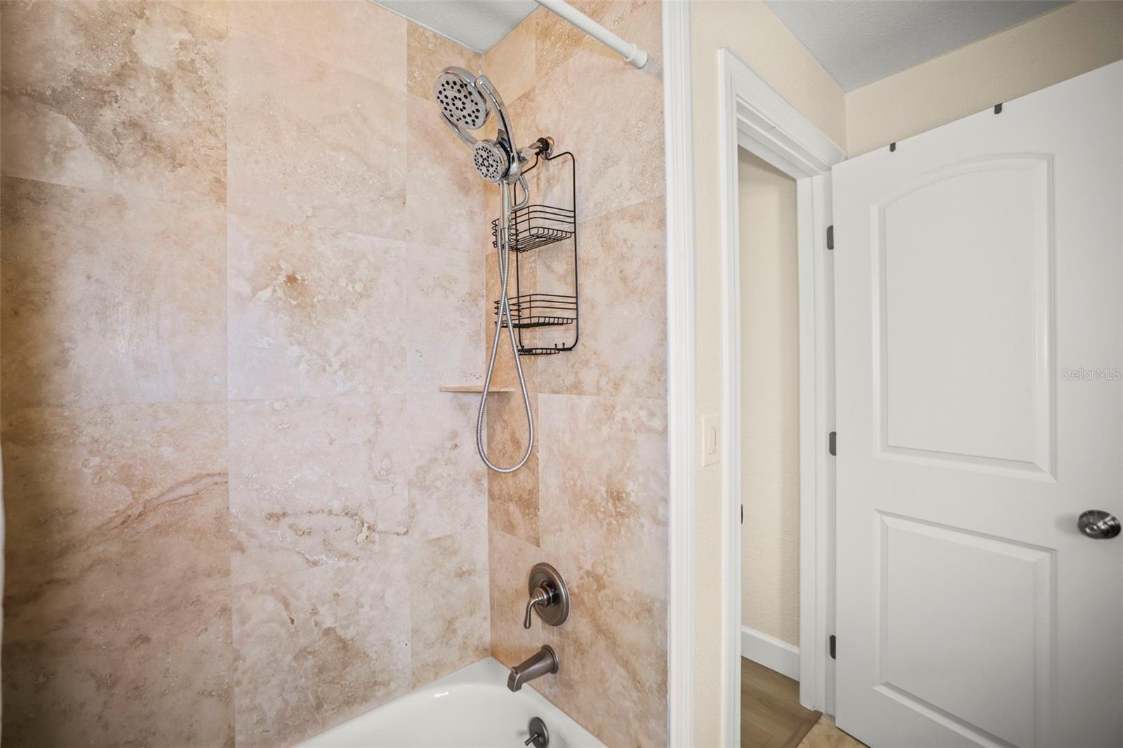 Second bathroom shower and tub combo.