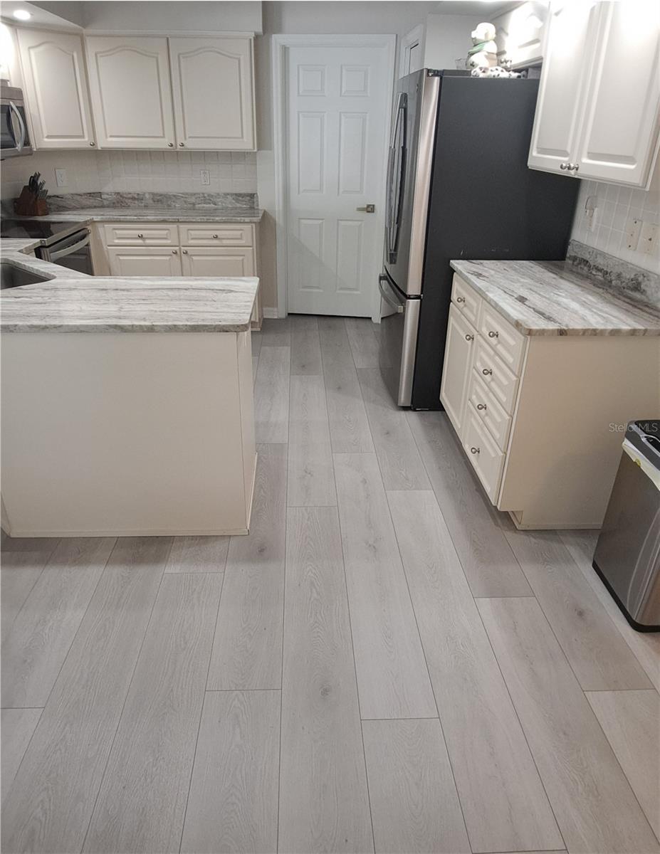 Kitchen - Laundry Room & Out to the Garage