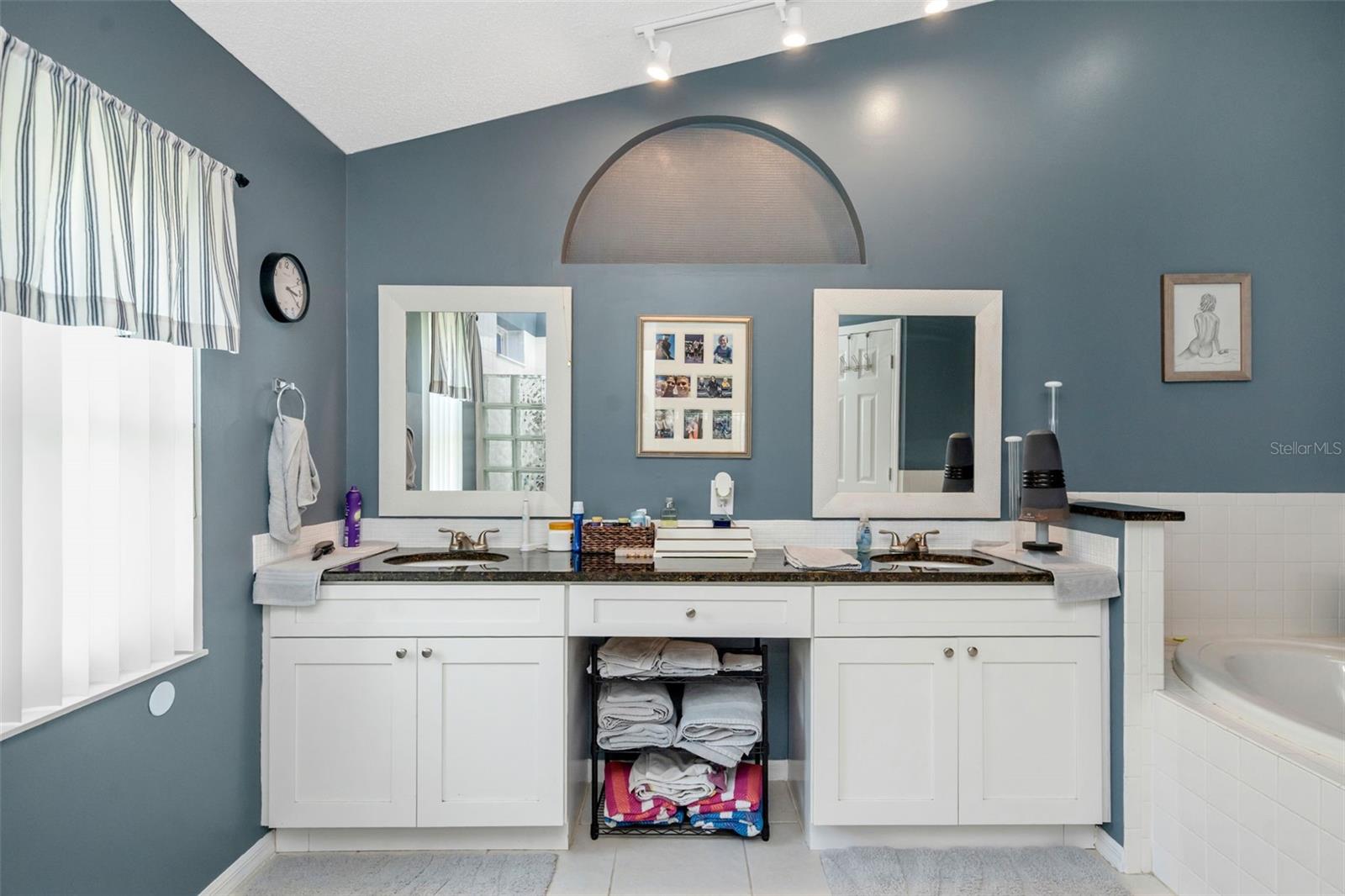 Primary Bathroom with water closet and dual sinks