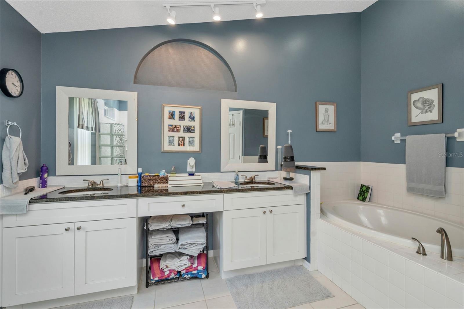 Primary Bathroom with water closet and dual sinks