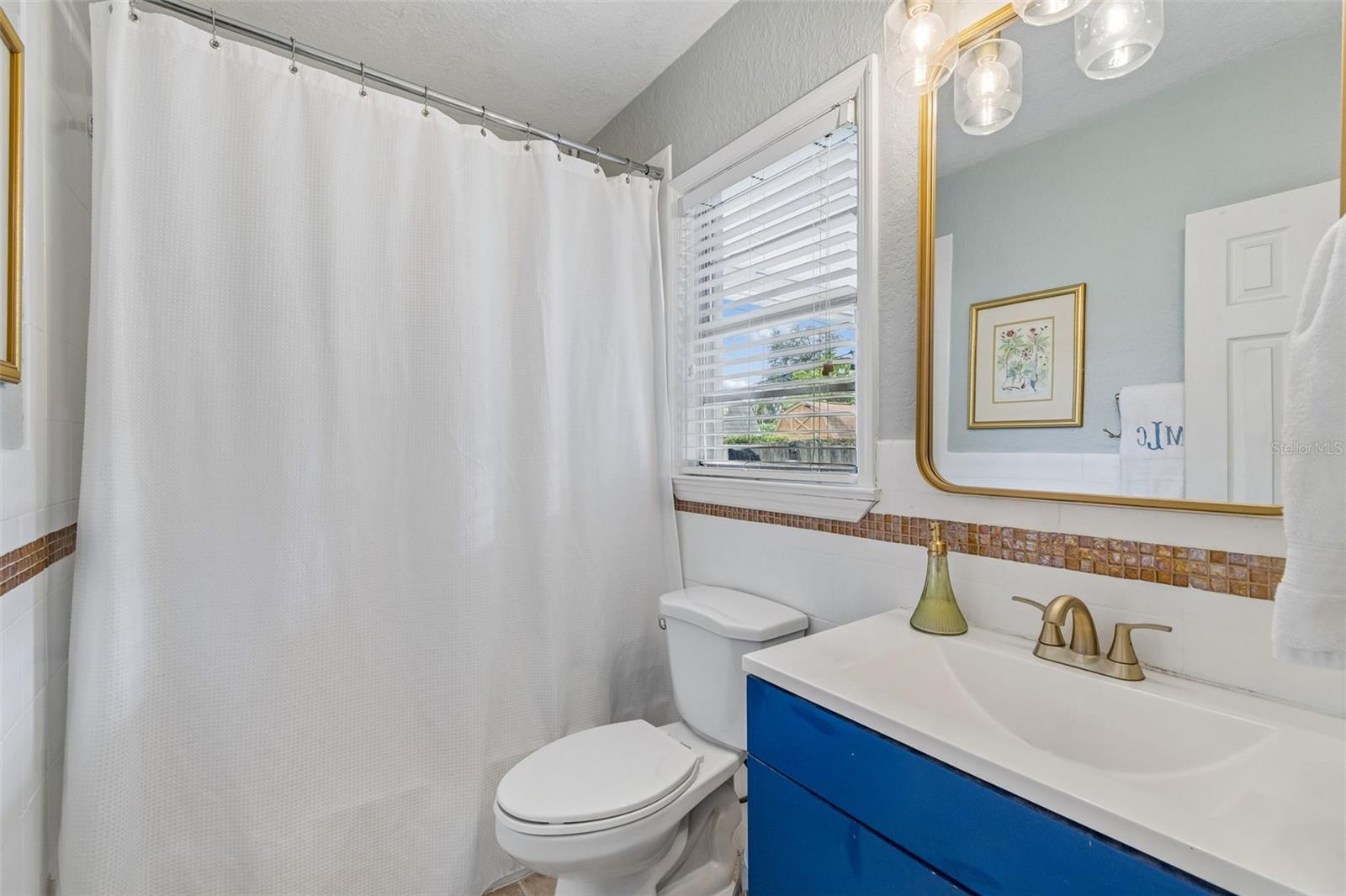 Primary bath that also services guests downstairs.