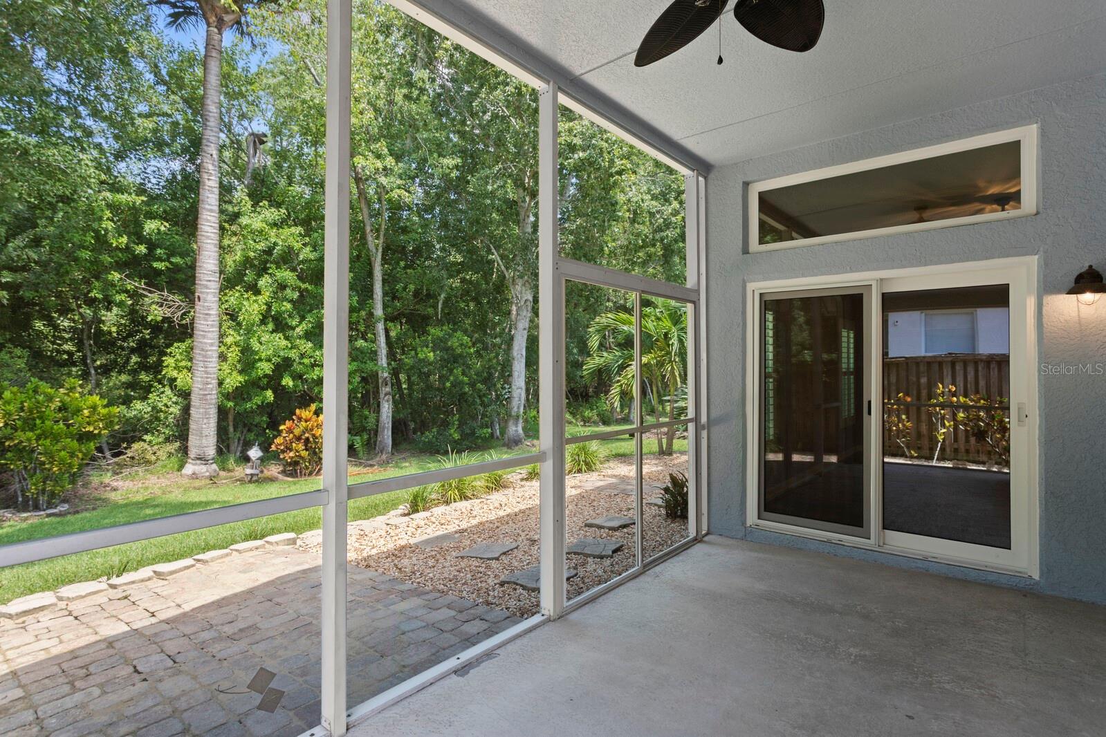 Screened-in back porch overlooking conservation area