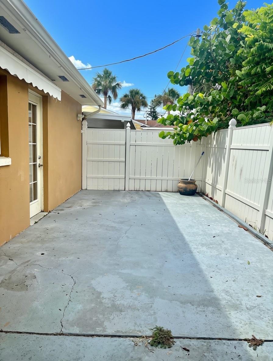 Private fenced courtyard off of primary bedroom