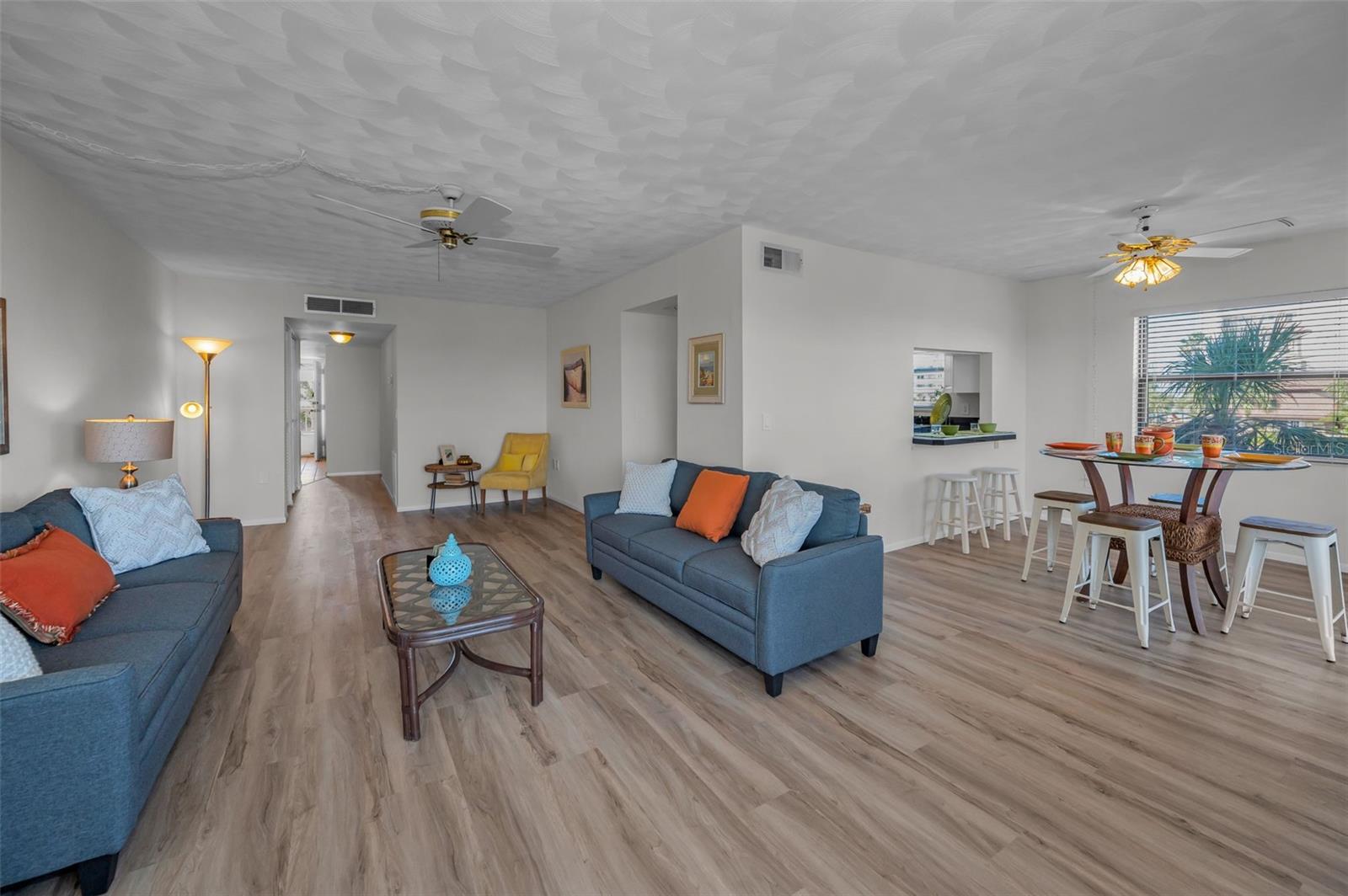.. Corner Unit # 301 ... Two Bedroom / Two Bath With 1225 SQ FT .. Here we have the View From The Waterfront Balcony Looking Into The Living Area. Corner Units have 1225 Sq Ft as opposed to Interior units with 1050 Sq Ft.