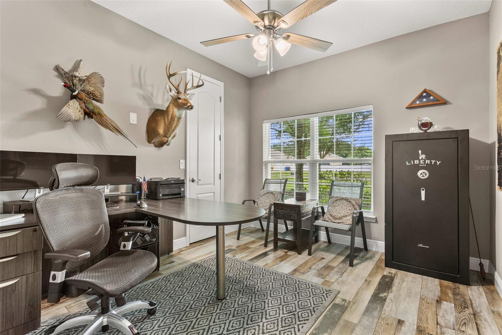 Spacious guest bedroom featuring abundant natural light, elegant finishes, and generous closet space.