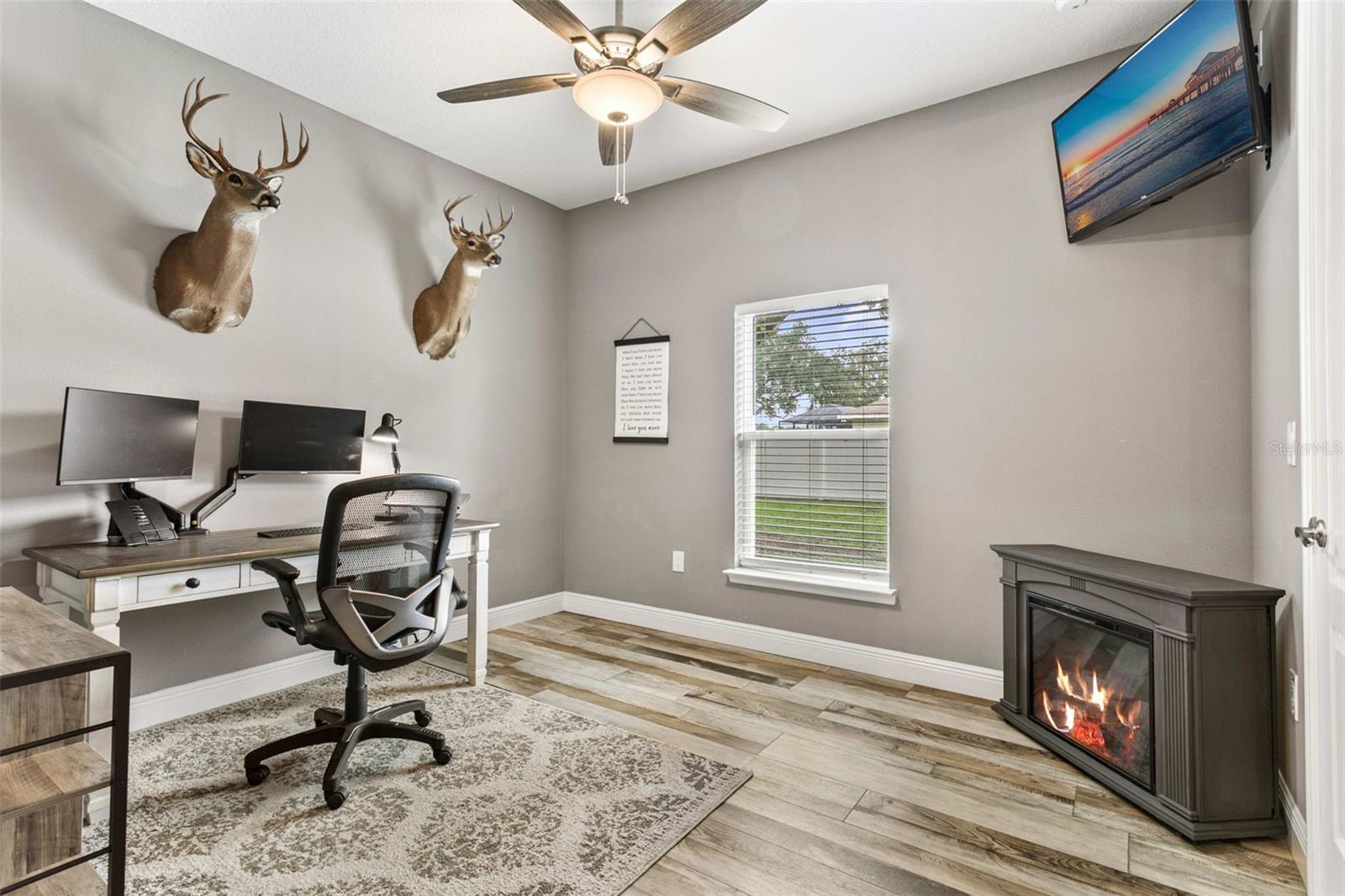Spacious guest bedroom featuring abundant natural light, elegant finishes, and generous closet space.