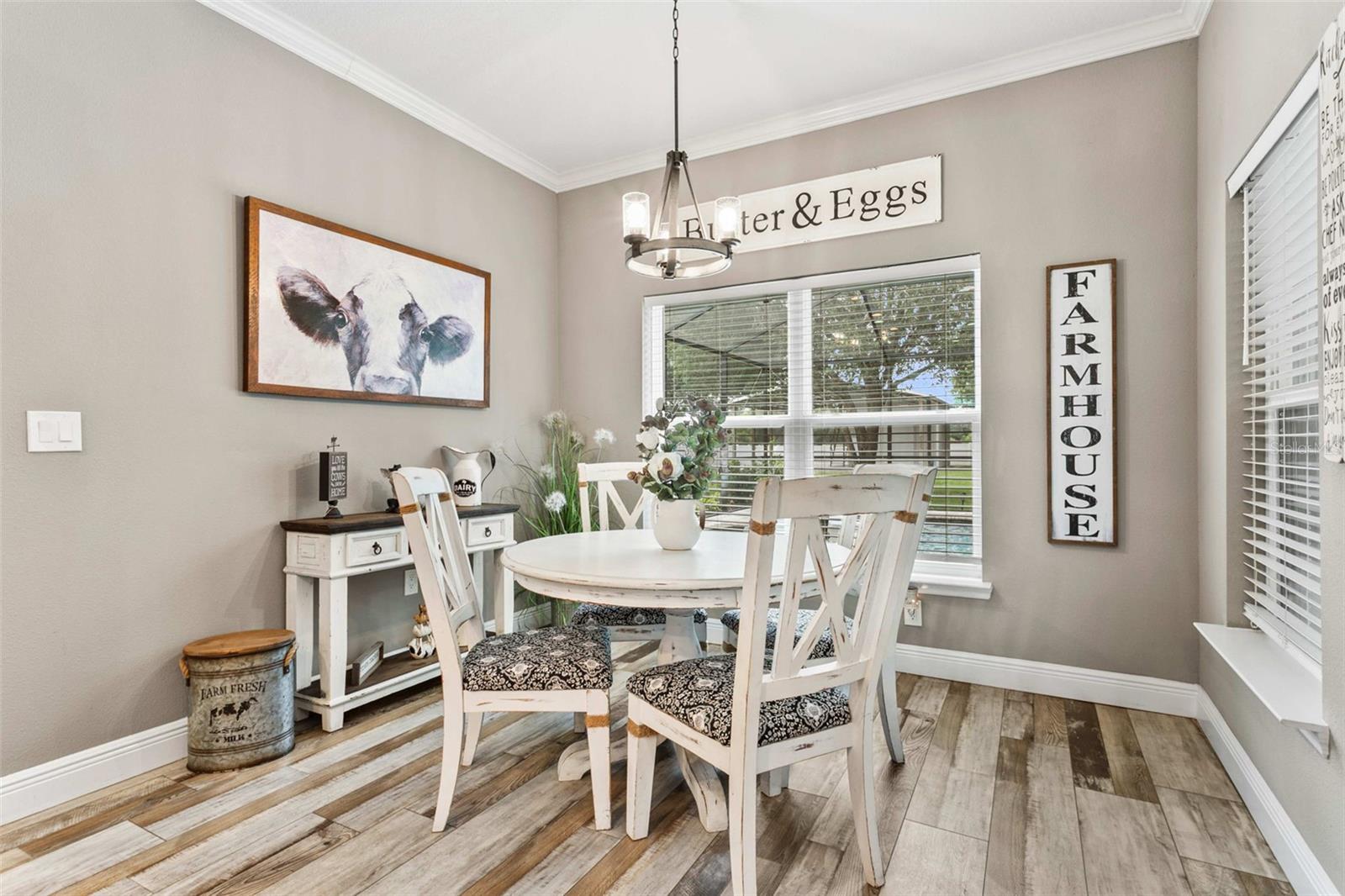 Bright breakfast nook overlooking the pool and outdoor entertaining area.