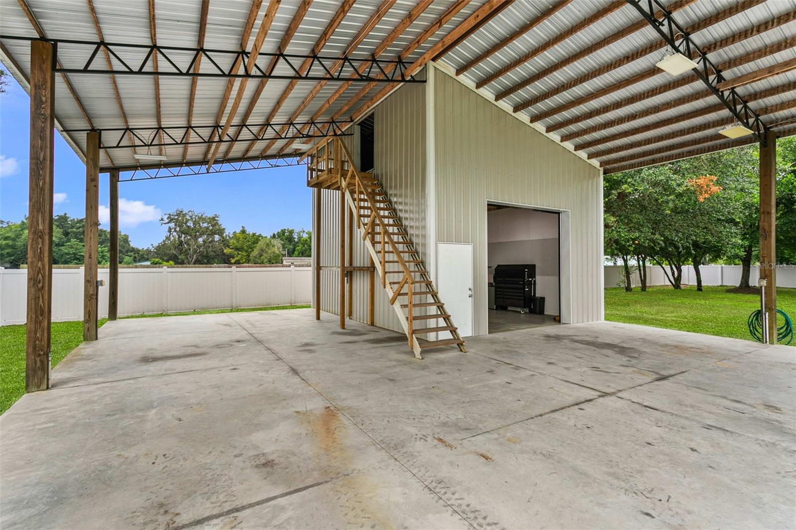 Covered RV parking with full hookups and easy access.