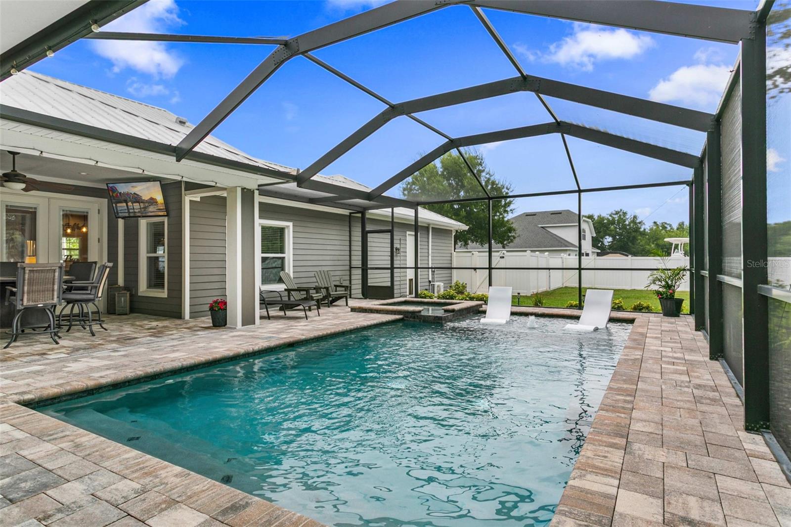Resort-style screened pool and lanai designed for year-round Florida living.