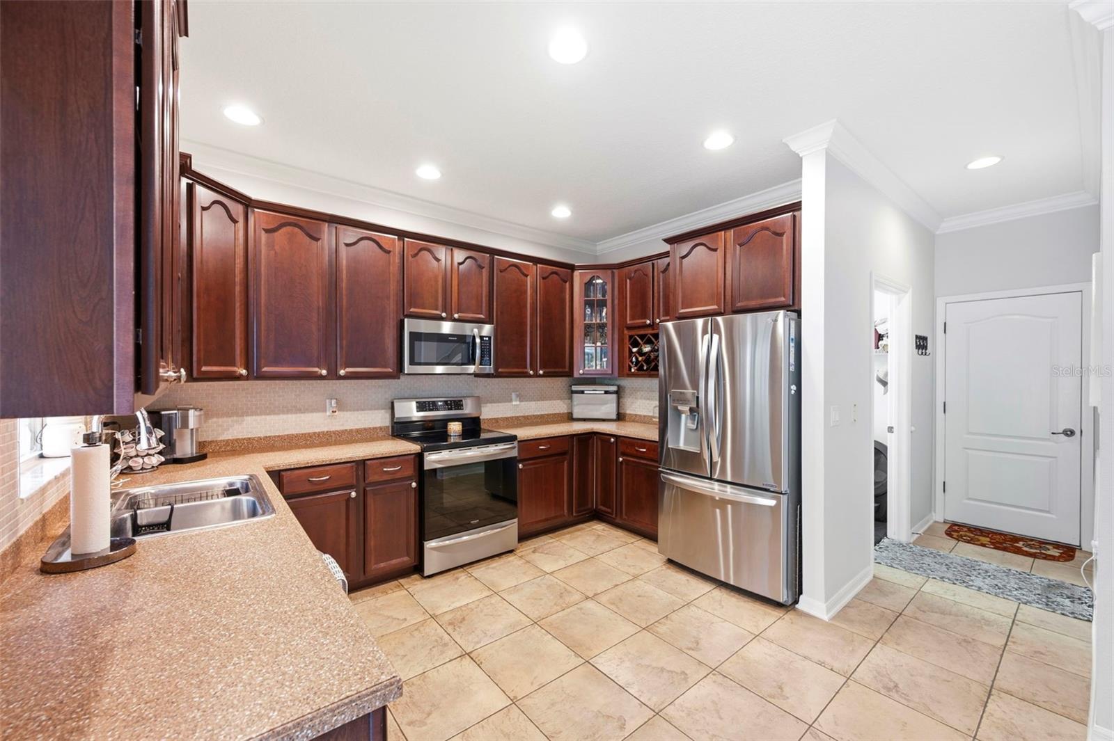 Door from kitchen leads to the garage.
