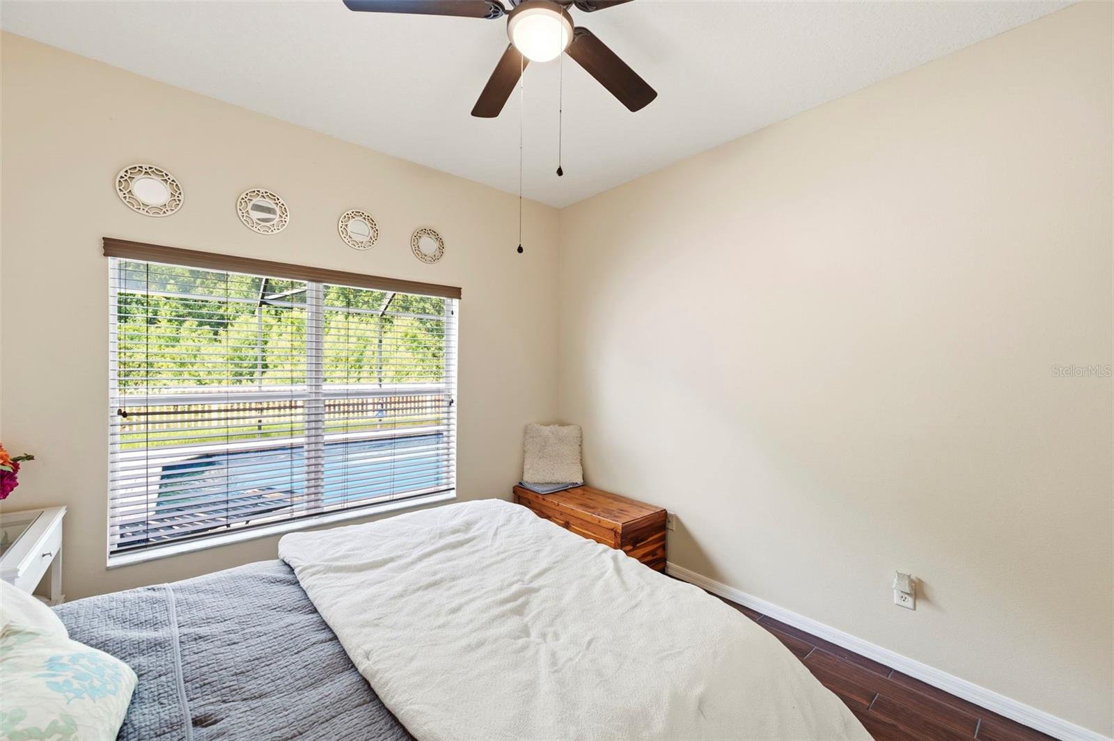 Bedroom has pool view.