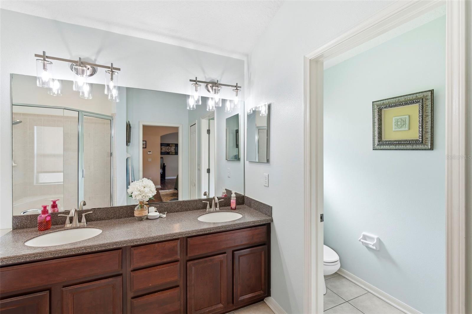 Dual sinks & private toilet room.