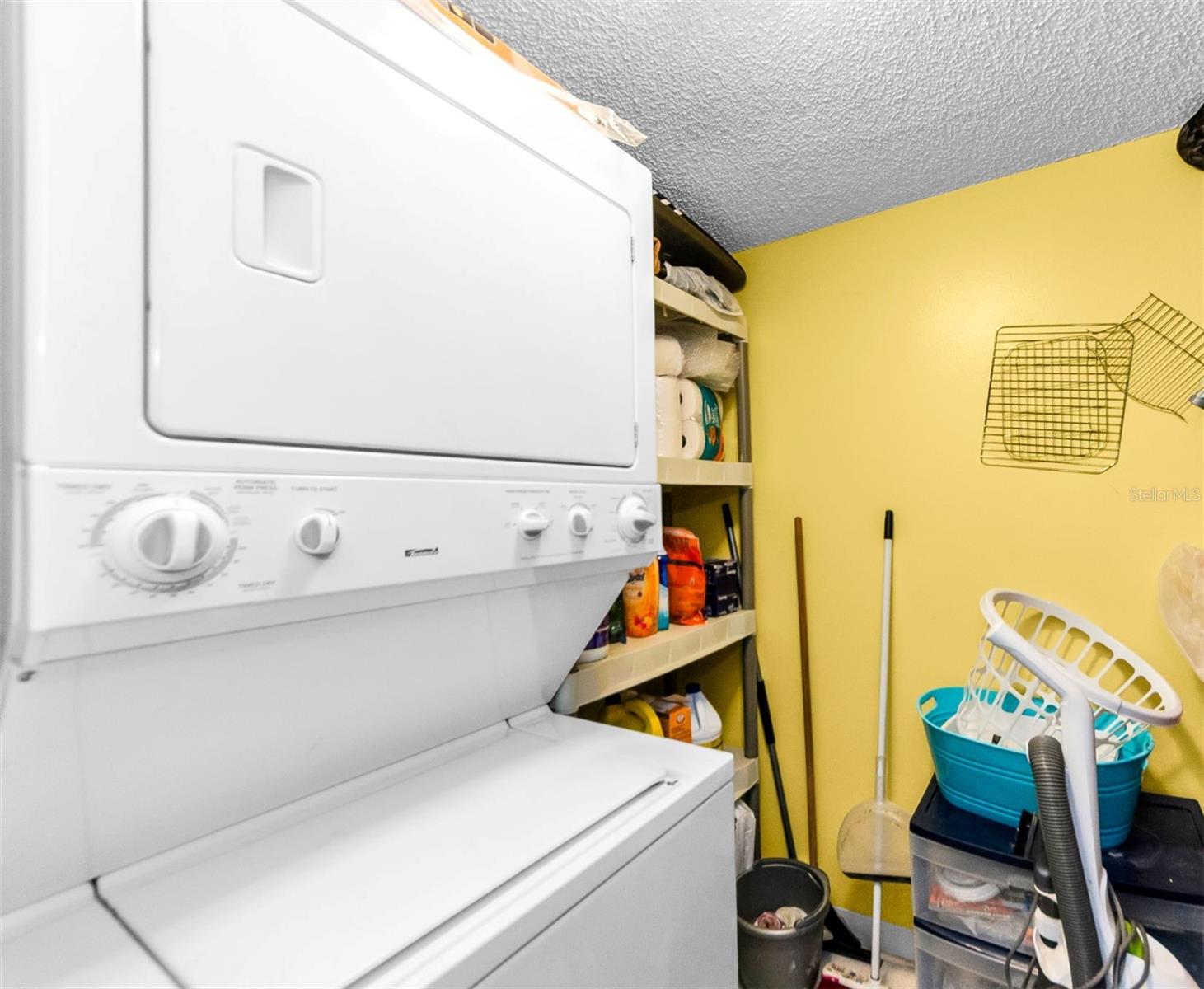 Separate Laundry room with storage