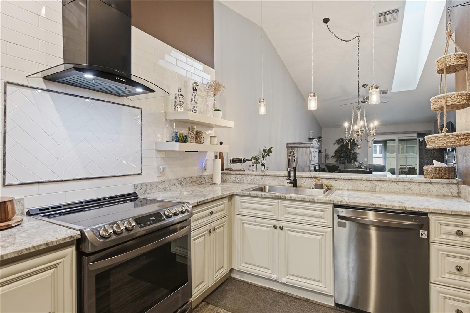 Subway tiled wall with Vent Hood.