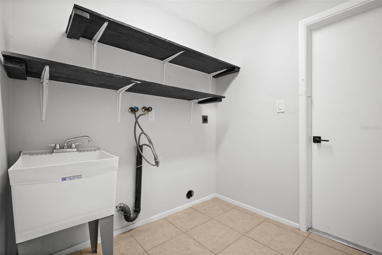 Laundry Room offers utility sink